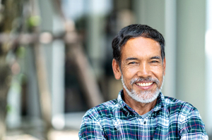 older man smiling because of treatment for low testosterone