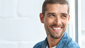 man smiling after male hormone therapy