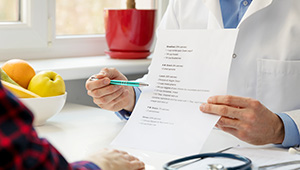 Doctor pointing to instructions on paper