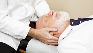 Man receiving neck massage