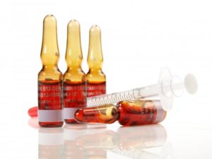 Vitamin B12 vials and needle