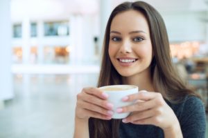 young woman holding mug