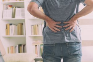 man dealing with back pain management in Richardson