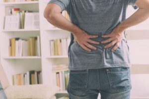 man dealing with back pain management in Richardson
