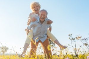 older couple smiling and being active