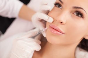 person getting treated who understands the difference between BOTOX and dermal fillers
